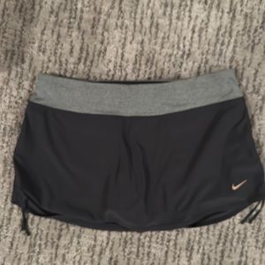 NIKE black and gray tennis skirt with built in shorts in women’s large.
